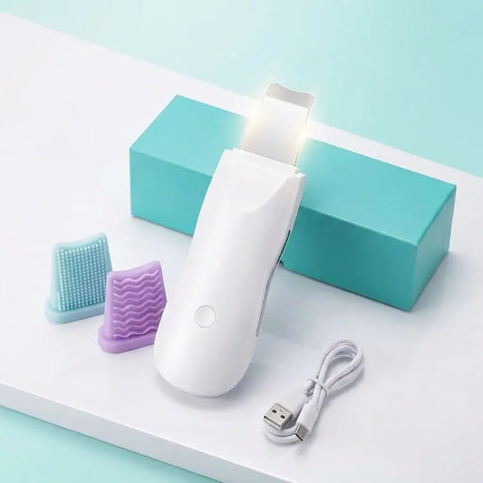 Paleta ultrasónica facial recargable USB para limpieza profunda y exfoliación suave. Ayuda a mejorar la absorción de sérums y el aspecto del rostro desde casa.